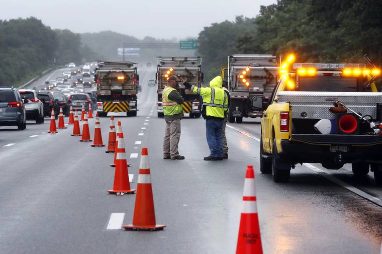 ASSOCIATED PRESS
                                Traffic on Interstate 95 is diverted in the area of an hours long standoff with a group of armed men that partially shut down the highway in Wakefield, Mass. Massachusetts state police say nine suspects have been taken into custody.