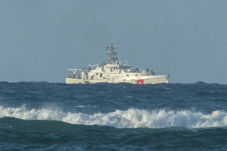 CRAIG T. KOJIMA / CKOJIMA@STARADVERTISER.COM
                                A U.S. Coast Guard cutter patrolled the area of debris from a 737 cargo plane that crashed off Oahu, Friday, near Honolulu. The plane made an emergency landing in the Pacific Ocean off the coast of Hawaii early Friday and both people on board were rescued.