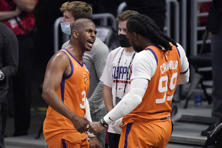 ASSOCIATED PRESS
                                Phoenix Suns guard Chris Paul, left, and forward Jae Crowder celebrated as time ran out in Game 6 of the NBA basketball Western Conference Finals against the Los Angeles Clippers, June 30, in Los Angeles. The Suns won the game 130-103.