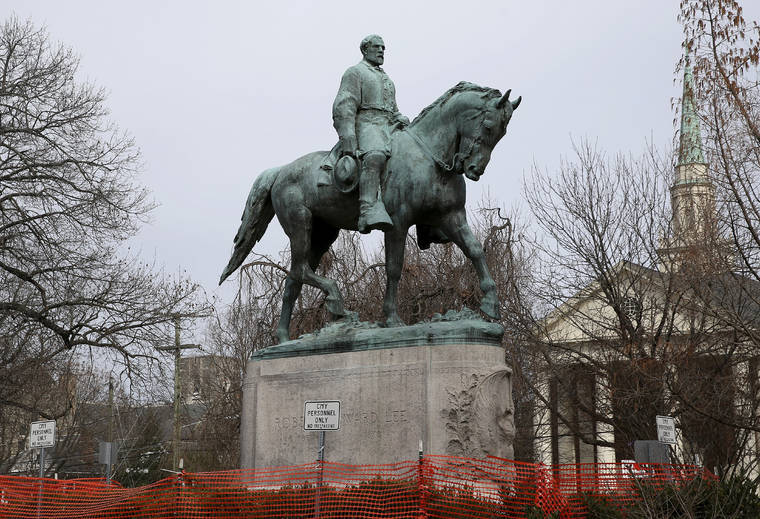 THE DAILY PROGRESS VIA AP
                                The statue of Robert E. Lee is seen uncovered in Emancipation Park in Charlottesville, Va., in 2018.