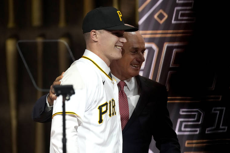 ASSOCIATED PRESS
                                Louisville’s Henry Davis stands with MLB Commissioner Rob Manfred after being selected by Pittsburgh Pirates as the number one overall pick in the first round of the 2021 MLB baseball draft today in Denver.