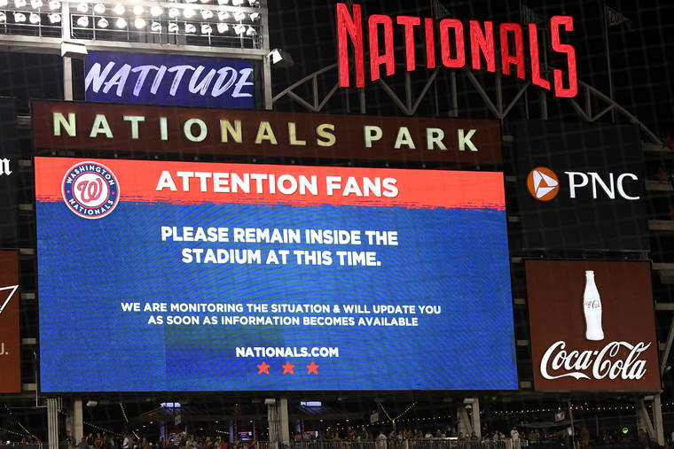 ASSOCIATED PRESS
                                The scoreboard displays a message to fans during a stoppage in play due to an incident near the ballpark in the sixth inning of a baseball game between the Washington Nationals and the San Diego Padres, tonight in Washington.
