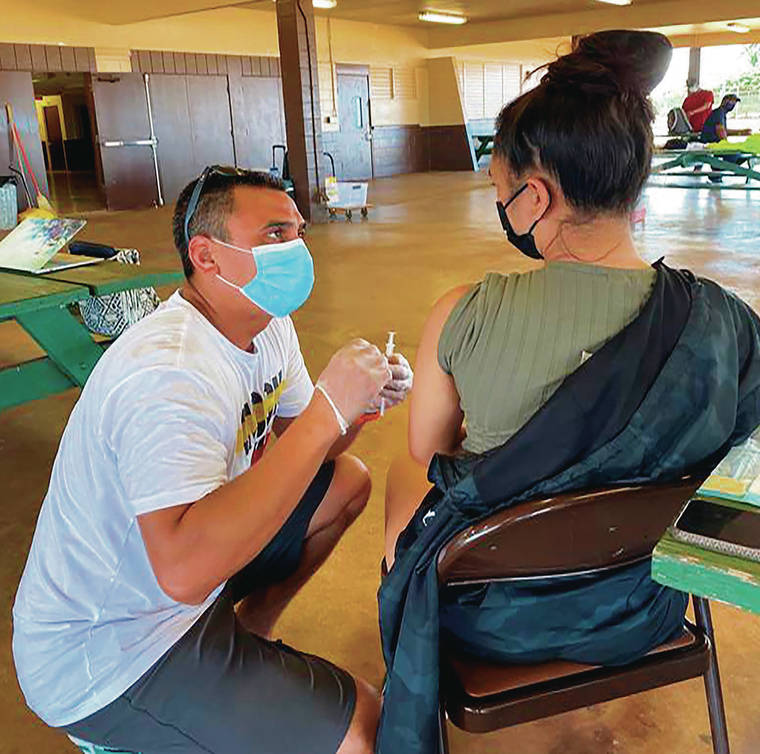 COURTESY BRYDEN KAAUWAI VIA ASSOCIATED PRESS
                                Dr. Kapono Chong-Hanssen administered COVID-19 vaccines July 10, 2020, in Kekaha, Hawaii.