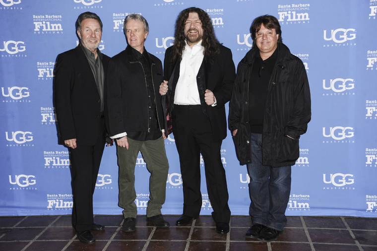 ASSOCIATED PRESS / 2015
                                Manager Budd Carr, from left, drummer Phil Ehart and vocalist and violinist Robert E. “Robby” Steinhardt, of Kansas, with director Charley Randazzo arrive at the 30th Santa Barbara International Film Festival Montecito Award ceremony on Jan. 30, 2015, in Santa Barbara, Calif. Steinhardt, a native of Lawrence, Kan., who was an original member of the band, died Saturday due to complications from pancreatitis. He was 71.