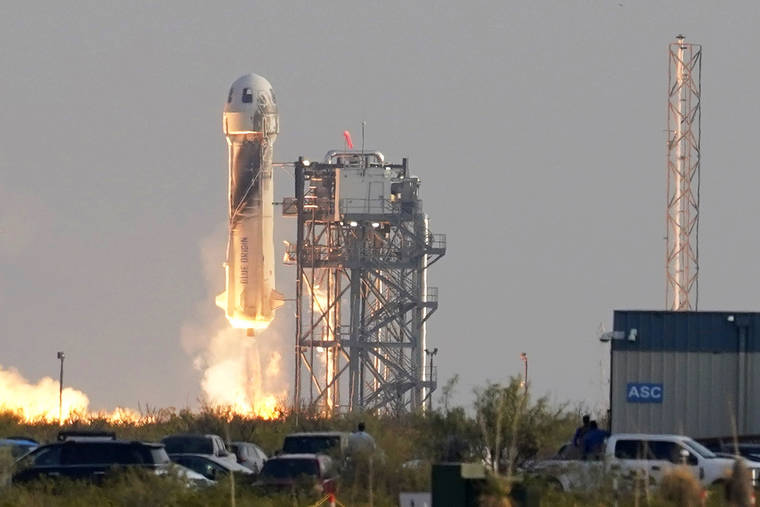 ASSOCIATED PRESS
                                Blue Origin’s New Shepard rocket launched, today, carrying passengers Jeff Bezos, founder of Amazon and space tourism company Blue Origin, his brother Mark Bezos, Oliver Daemen and Wally Funk, from its spaceport near Van Horn, Texas.