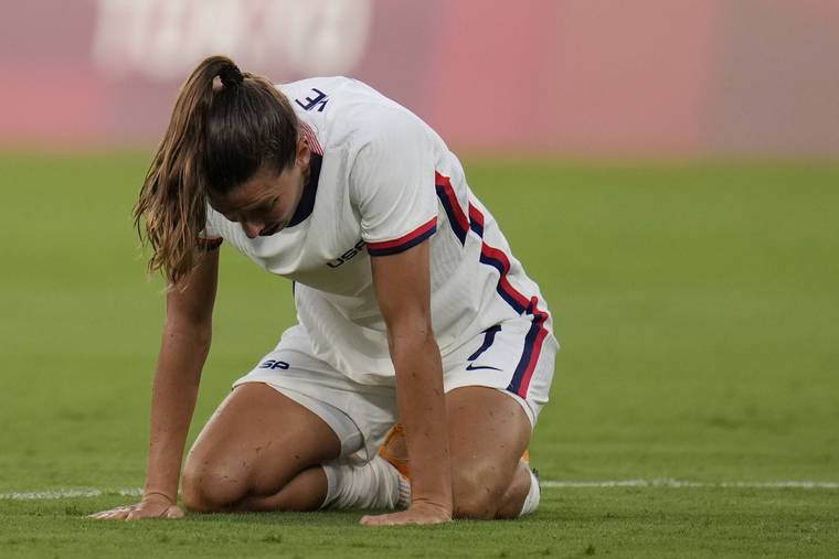 ASSOCIATED PRESS
                                United States’ Tobin Heath reacted after losing 0-3 against Sweden during a women’s soccer match at the 2020 Summer Olympics, Wednesday, in Tokyo.