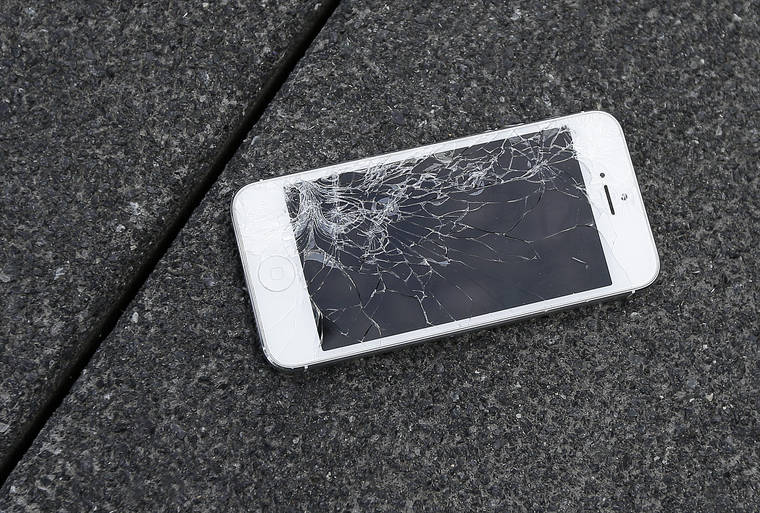 ASSOCIATED PRESS
                                An Apple iPhone with a cracked screen, seen in August 2015, after a drop test from the DropBot, a robot used to measure the sustainability of a phone to dropping, at the offices of SquareTrade in San Francisco. Responding to a new competition directive from the Biden White House, today, the Federal Trade Commission is moving toward writing new rules aimed at helping small repair businesses and saving consumers money on repair costs.