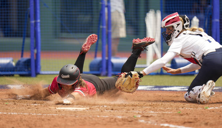 ASSOCIATED PRESS
                                Canada’s Joey Lye, left, is tagged by the United States’ Aubree Munro at home plate.