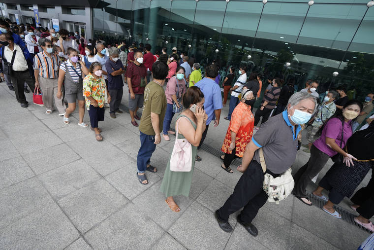 ASSOCIATED PRESS
                                Residents waited in line to receive shots of the AstraZeneca COVID-19 vaccine at the Central Vaccination Center in Bangkok, Thailand, Thursday.
