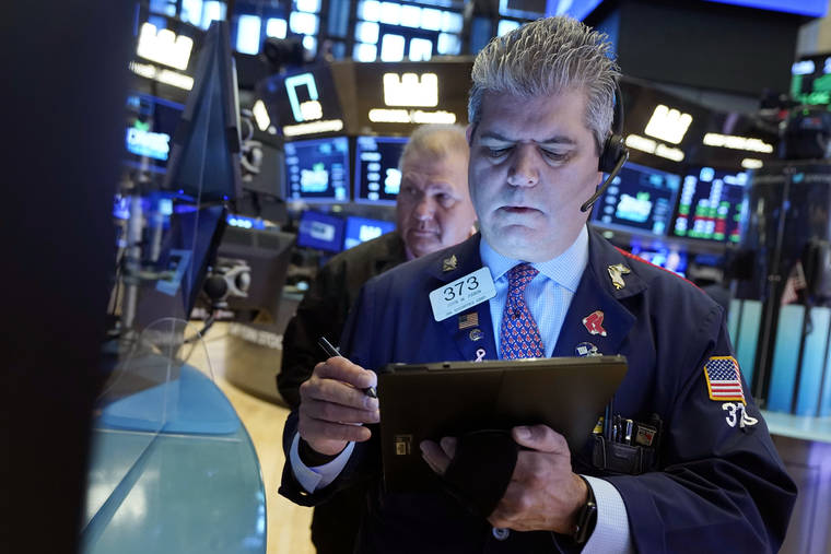 ASSOCIATED PRESS
                                Trader John Panin, foreground, worked on the floor of the New York Stock Exchange, today. Stocks rallied to records on Wall Street today, and the Dow Jones Industrial Average closed above the 35,000 level for the first time, as the market continued to roar back from its short-lived swoon at the start of the week.
