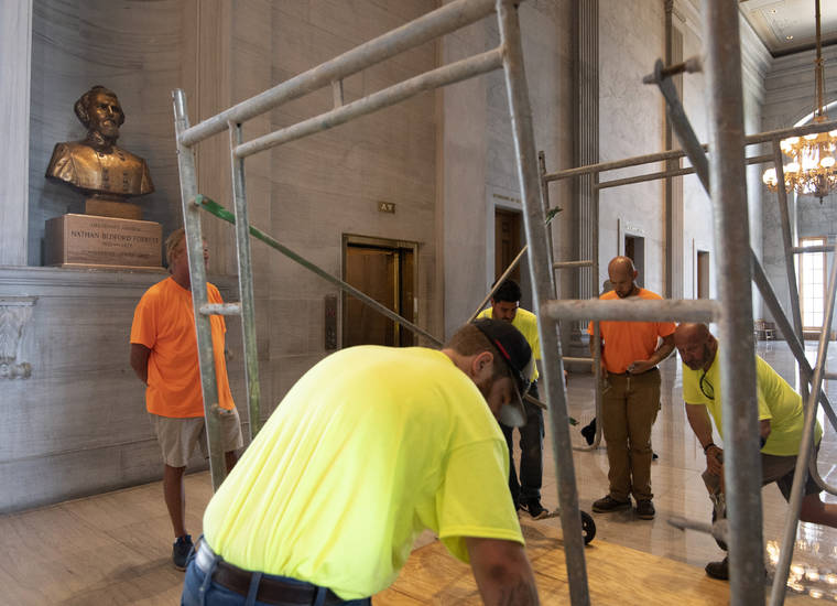 GEORGE WALKER IV/THE TENNESSEAN VIA AP
                                Workers prepare scaffolding in front of a bust of Confederate general and early Ku Klux Klan leader Nathan Bedford Forrest at the State Capitol in Nashville, Tenn. A decadeslong effort to remove the bust from the Tennessee Capitol cleared its final hurdle Thursday, with state leaders approving the final vote needed to allow the statue to be relocated to a museum.