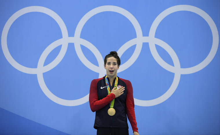 ASSOCIATED PRESS / 2016
                                United States’ Maya DiRado celebrates with her gold medal during the women’s 200-meter backstroke medals ceremony during the swimming competitions at the 2016 Summer Olympics in Rio de Janeiro, Brazil. A debate is fomenting between former gold medalist DiRado and some American swimmers over Michael Andrew’s decision not to be vaccinated against the COVID-19 virus on the eve of competition at the Tokyo Olympics.