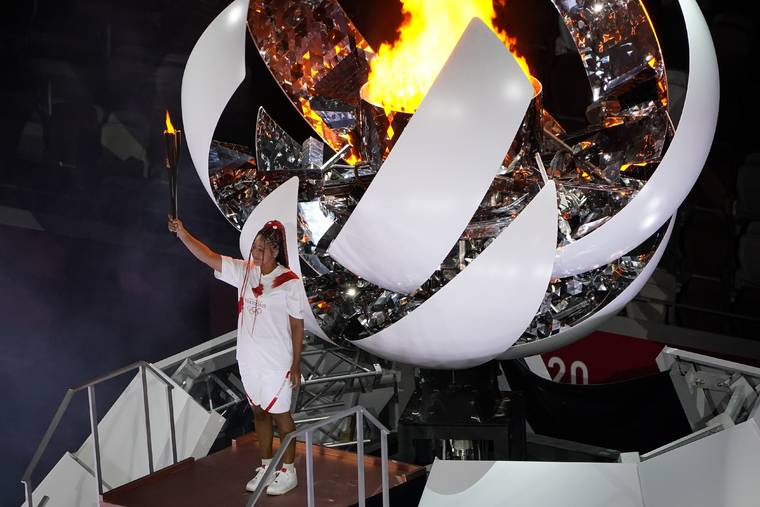 ASSOCIATED PRESS
                                Naomi Osaka lights the Olympic cauldron during the opening ceremony at the Olympic Stadium at the 2020 Summer Olympics, Friday, July 23, in Tokyo.