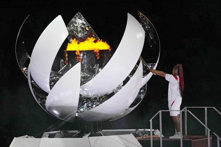 ASSOCIATED PRESS
                                Naomi Osaka lights the Olympic flame during the opening ceremony in the Olympic Stadium at the 2020 Summer Olympics, Friday, July 23, in Tokyo, Japan.