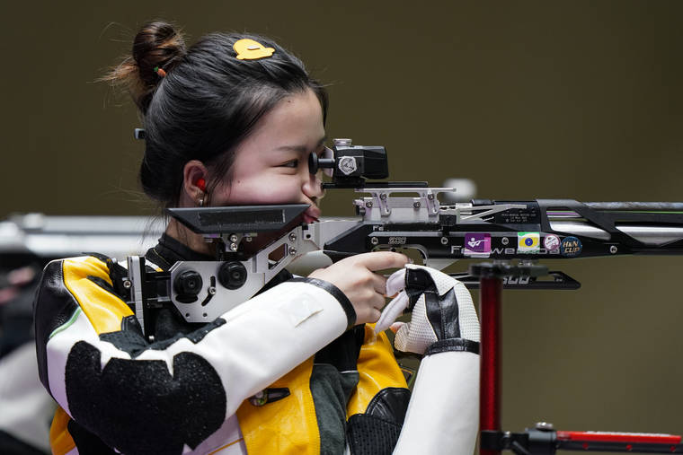 ASSOCIATED PRESS
                                Yang Qian, of China, competes in the women’s 10-meter air rifle at the Asaka Shooting Range.