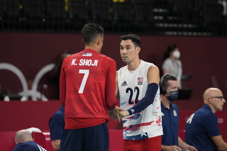 ASSOCIATED PRESS
                                Kawika Shoji and Erik Shoji of the United States’ talk on the court during a men’s volleyball preliminary round pool B match against France, at the 2020 Summer Olympics, Saturday, July 24, 2021, in Tokyo, Japan.