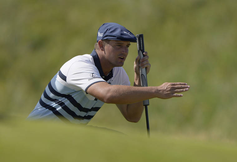 ASSOCIATED PRESS
                                Bryson DeChambeau gestures as he lines up his putt on the 2nd green during the third round of the British Open Golf Championship on July 17.
