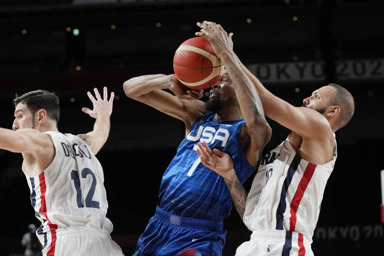 ASSOCIATED PRESS
                                United States’ forward Kevin Durant (7) and France’s Evan Fournier, right, fight for control of the ball during a men’s basketball preliminary round game at the 2020 Summer Olympics today in Saitama, Japan.
