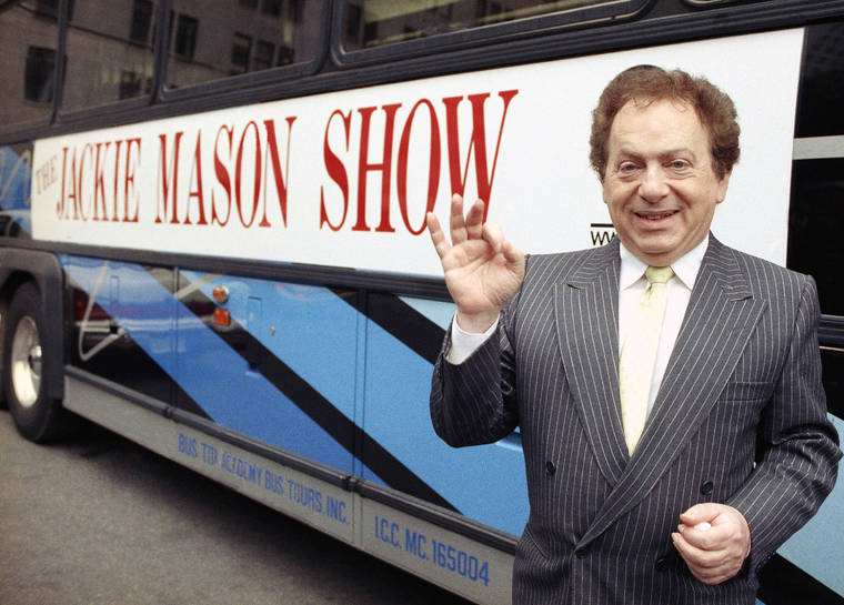 ASSOCIATED PRESS / 1992
                                Actor/comedian Jackie Mason stands beside a bus displaying a sign advertising his TV show in 1992. Mason, a rabbi-turned-jokester whose feisty brand of standup comedy got laughs from nightclubs in the Catskills to West Coast talk shows and Broadway stages, died Saturday in Manhattan. He was 93.