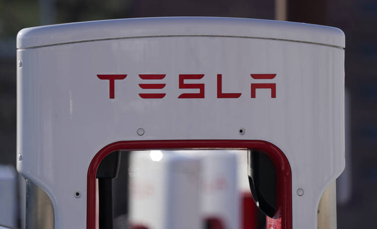 ASSOCIATED PRESS / FEBRUARY 25
                                The company logo is shown at the top of a supercharger for Tesla automobiles near shops in Boulder, Colo.