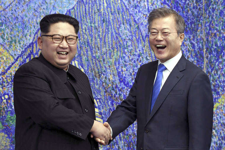 COURTESY KOREA SUMMIT PRESS POOL VIA ASSOCIATED PRESS / 2018
                                North Korean leader Kim Jong Un, left, poses with South Korean President Moon Jae-in for a photo inside the Peace House at the border village of Panmunjom in Demilitarized Zone, South Korea.
