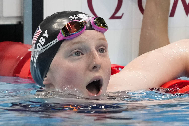 ASSOCIATED PRESS
                                Lydia Jacoby, of the United States, reacts after winning the final of the women’s 100-meter breaststroke at the 2020 Summer Olympics, Tuesday, in Tokyo, Japan.