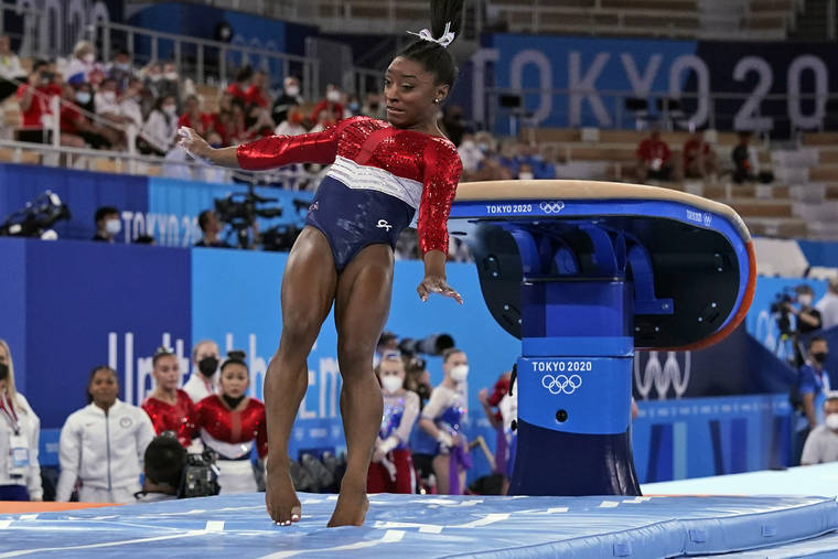 ASSOCIATED PRESS
                                Simone Biles lands from the vault during the artistic gymnastics women’s final at the Summer Olympics today in Tokyo.
