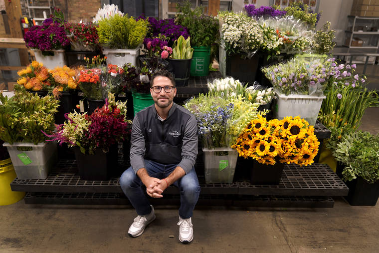 ASSOCIATED PRESS
                                Steven Dyme, owner of Flowers for Dreams, poses for a portrait at his warehouse Friday, in Chicago.
