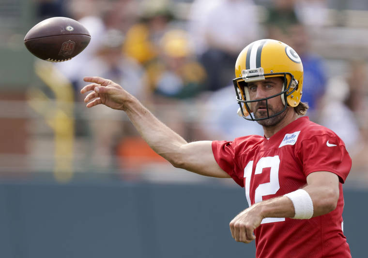 ASSOCIATED PRESS
                                Green Bay Packers’ quarterback Aaron Rodgers passes during NFL football training camp today in Green Bay, Wis.