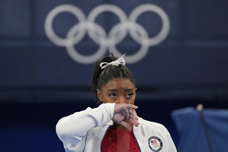 ASSOCIATED PRESS
                                Simone Biles, of the United States, watches gymnasts perform at the 2020 Summer Olympics, Tuesday, in Tokyo.