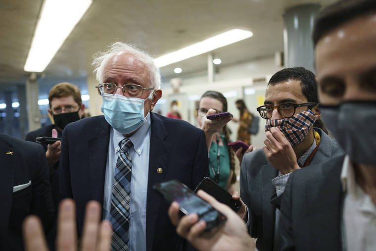ASSOCIATED PRESS
                                Sen. Bernie Sanders, I-Vt., talks to reporters at the Capitol in Washington on Wednesday.