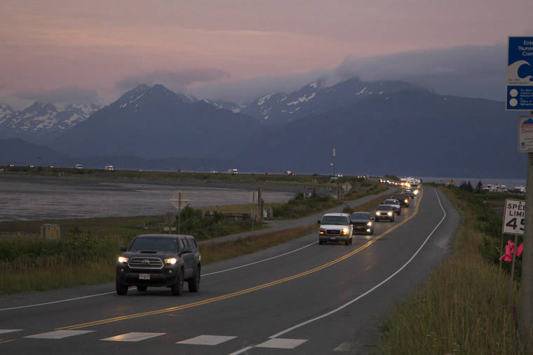 ASSOCIATED PRESS
                                A line of cars evacuates the Homer Spit in Homer, Alaska Wednesday night, after a tsunami warning was issued following a magnitude 8.2 earthquake. The tsunami warning for much of Alaska’s southern coast was canceled when the biggest wave, of just over a half foot, was recorded in Old Harbor, Alaska.