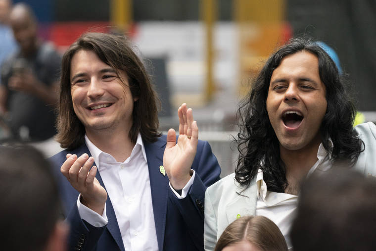 ASSOCIATED PRESS
                                Vladimir Tenev, CEO and Co-Founder of Robinhood, left, celebrates in New York’s Times Square with fellow Co-Founder Baiju Bhatt following their company’s IPO, today. Robinhood is selling its own stock on Wall Street, the very place the online brokerage has rattled with its stated goal of democratizing finance. Through its app, Robinhood has introduced millions to investing and reshaped the brokerage industry, all while racking up a long list of controversies in less than eight years.