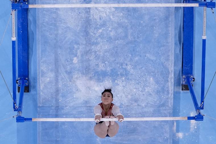 ASSOCIATED PRESS
                                Sunisa Lee, of the United States, performs on the uneven bars.