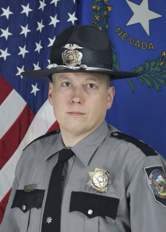 COURTESY NEVADA HIGHWAY PATROL VIA ASSOCIATED PRESS
                                Trooper Micah May, 46, died Thursday after he was struck and critically injured by a vehicle while deploying spike strips Tuesday to stop a chase on a busy freeway near the Las Vegas Strip.