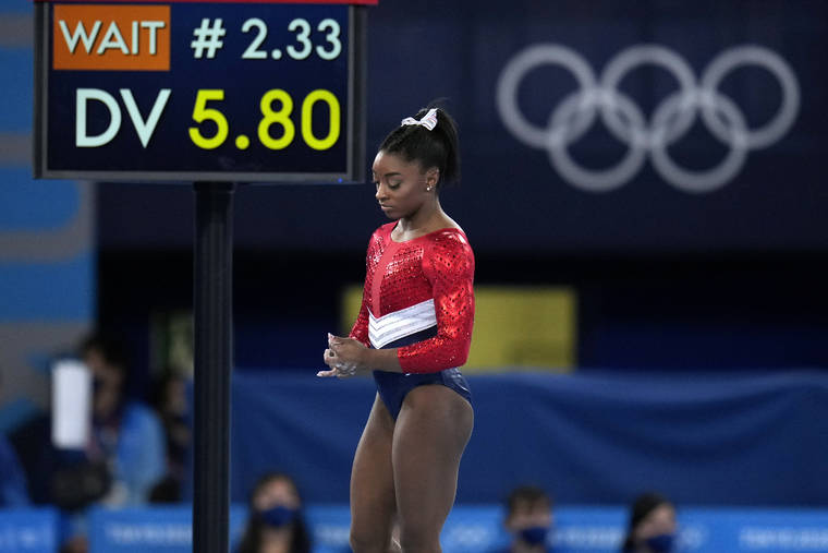 ASSOCIATED PRESS
                                Simone Biles, of the United States, waits to perform on the vault during the artistic gymnastics women’s final at the 2020 Summer Olympics, Tuesday, in Tokyo.