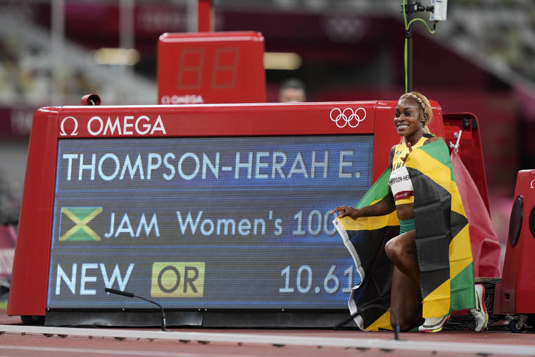 ASSOCIATED PRESS
                                Elaine Thompson-Herah, of Jamaica, celebrates after winning the women’s 100-meter final at the 2020 Summer Olympics today in Tokyo.