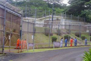 STAR-ADVERTISER / 2019
                                Female inmates walking along the fence line at Women’s Community Correctional Center prison facilities in Kailua.