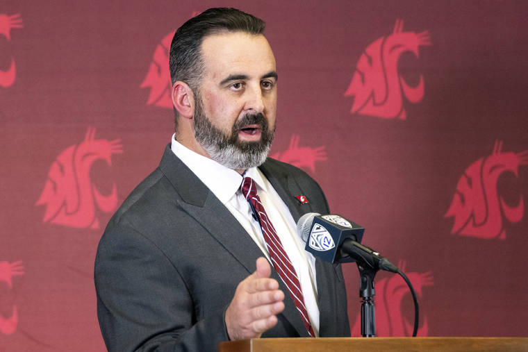 LEWISTON TRIBUNE VIA AP
                                New Washington State football coach Nick Rolovich speaks during a news conference after being officially introduced as the head coach on Jan. 16, 2020, in Pullman, Wash.