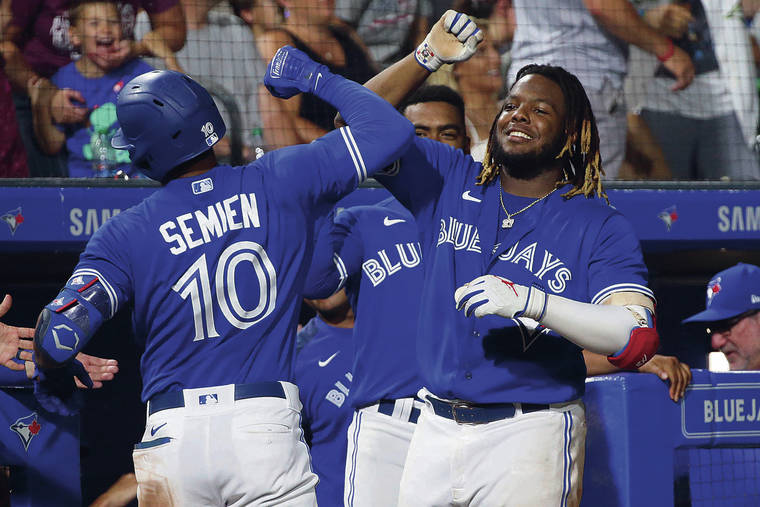 ASSOCIATED PRESS
                                Toronto’s Marcus Semien celebrates his three-run home run with Vladimir Guerrero Jr. during the seventh inning of the team’s baseball game against the Seattle Mariners on Tuesday.