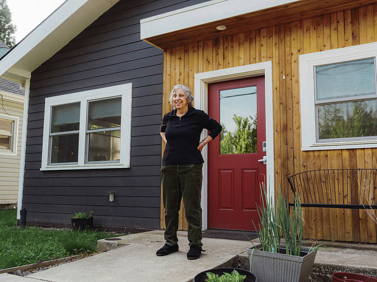 NEW YORK TIMES
                                Above, Alice Savage in front of her “accessory dwelling unit” in the backyard of the Portland, Ore., home where her daughter and son-in-law live.