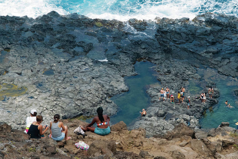 CRAIG T. KOJIMA / CKOJIMA@STARADVERTISER.COM
                                Oahu residents are feeling the strain of overtourism, particularly in hot spots that were identified through a pending Hawaii Tourism Authority Destination Management Action Plan. At the Makapuu Lighthouse trail, one such hotspot, visitors hike to rocky tide pools.