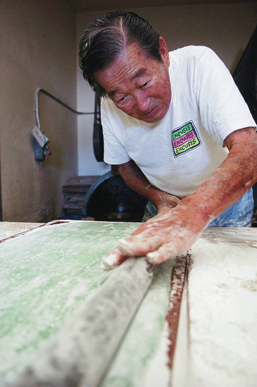 STAR-ADVERTISER / 2005
                                Richard Hirao rolled out just-pounded mochi at the shop in 2005. Richard, his brother Thomas and their sisters were the second generation to run the business. The business is now led by Richard’s son, Mike Hirao.