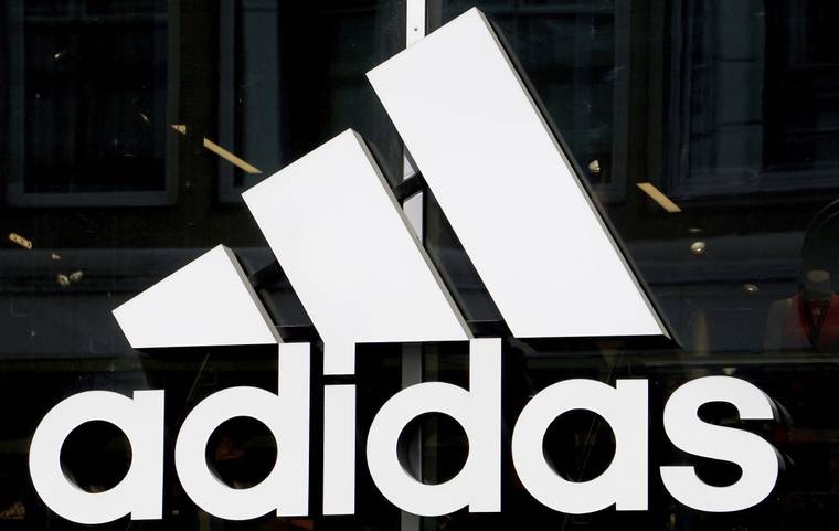 ASSOCIATED PRESS
                                The logo of the sports goods manufacturer Adidas, seen in May 2019, in Berlin, Germany. The University of Hawaii has reached an apparel and equipment deal with Adidas.