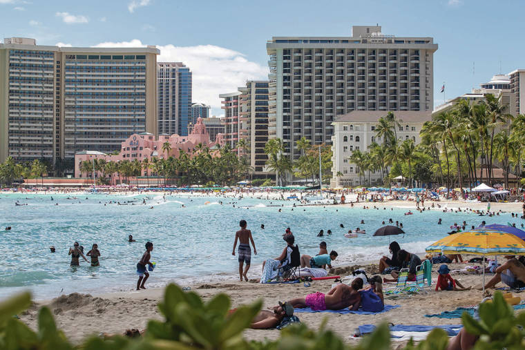 CINDY ELLEN RUSSELL / CRUSSELL@STARADVERTISER.COM
                                Beachgoers lined the shores of Waikiki on July 8.