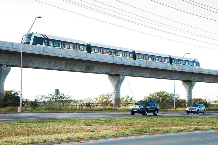 CRAIG T. KOJIMA / MAY 28
                                Honolulu’s rail cars have been taken out of service after a passenger door remained open while the train was moving during a test run. A Honolulu rail car goes through a test run in Kapolei.