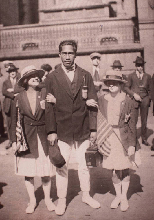 STAR-ADVERTISER / 1920 
                                Aileen Riggin Soule, right, stood next to Duke Kahanamoku, whom she said looked after her like a big brother.