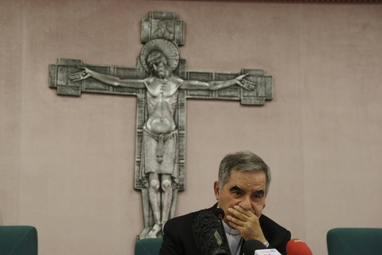 ASSOCIATED PRESS
                                Cardinal Angelo Becciu meets the media during press conference in Rome on Sept. 25.