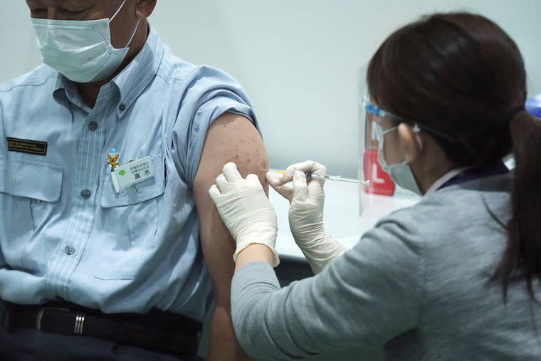 ASSOCIATED PRESS
                                A Tokyo Metropolitan Government employee takes the Moderna’s COVID-19 vaccine shot at a newly opened vaccination center at the local government building on July 1.