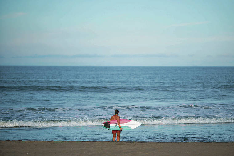 ASSOCIATED PRESS 
                                Hawaii’s Carissa Moore, surfing for the United States, looked out at the waves before a practice session for the Tokyo Olympics at Tsurigasaki Beach in Ichinomiya, Japan, on Wednesday.